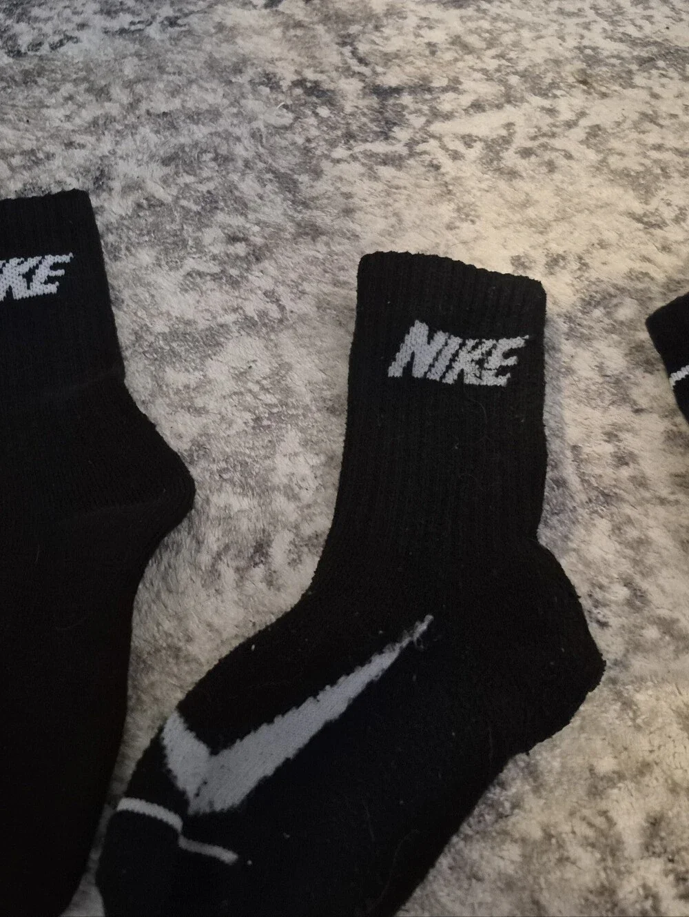 8 pairs of Nike black xs socks and 3 extra no matches socks